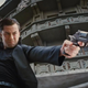 young joe firing a gun
